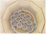 Loading kiln with greenware chalices Loading kiln with greenware chalices